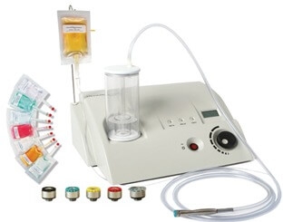 The DermaSweep machine with its bristle treatment tips and infusion solutions